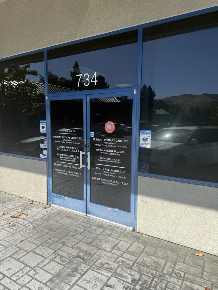 Blue entrance doors marked 734 at Fremont Primary Care